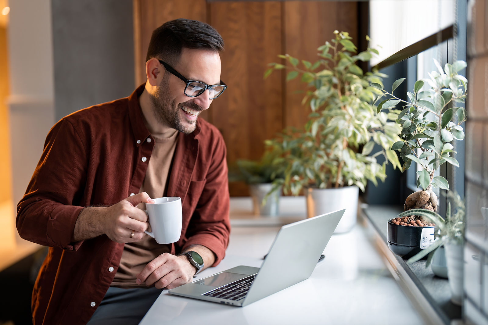 Man working on a laptop at home